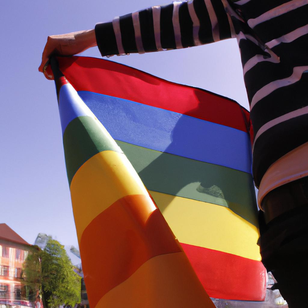 Person holding rainbow flag, protesting